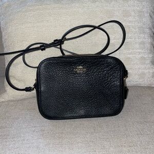 Coach black crossbody with adjustable strap. Gold hardware.